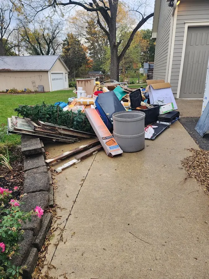 Dumpster being loaded with debris for Commercial Dumpster Rental in Woodstown